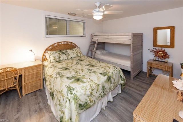 bedroom featuring dark wood-style flooring and a ceiling fan