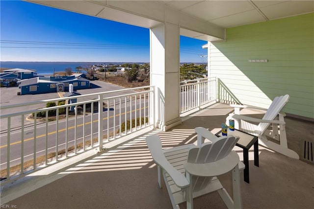 balcony featuring a water view