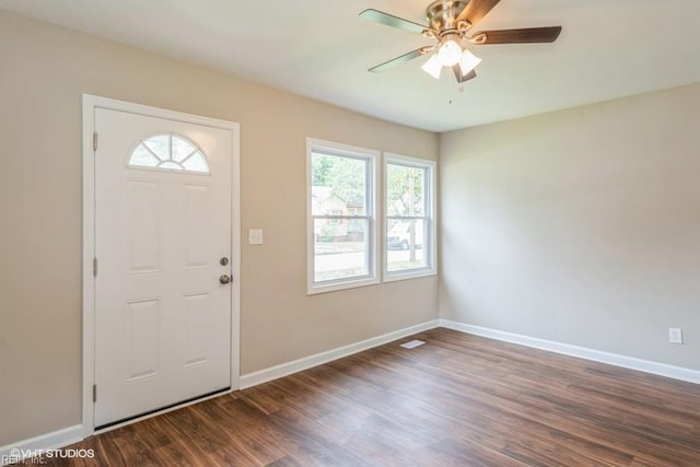 foyer entrance with ceiling fan and dark hardwood / wood-style flooring