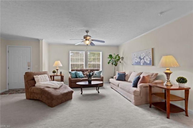 carpeted living room featuring ceiling fan, ornamental molding, and a textured ceiling