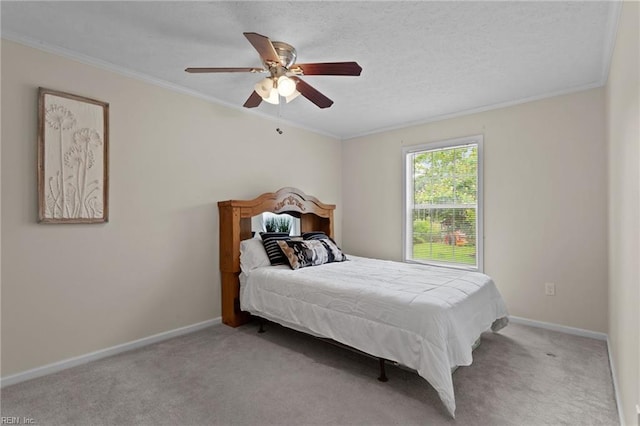 bedroom featuring crown molding, ceiling fan, light carpet, and a textured ceiling