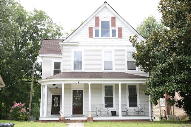 victorian house featuring covered porch