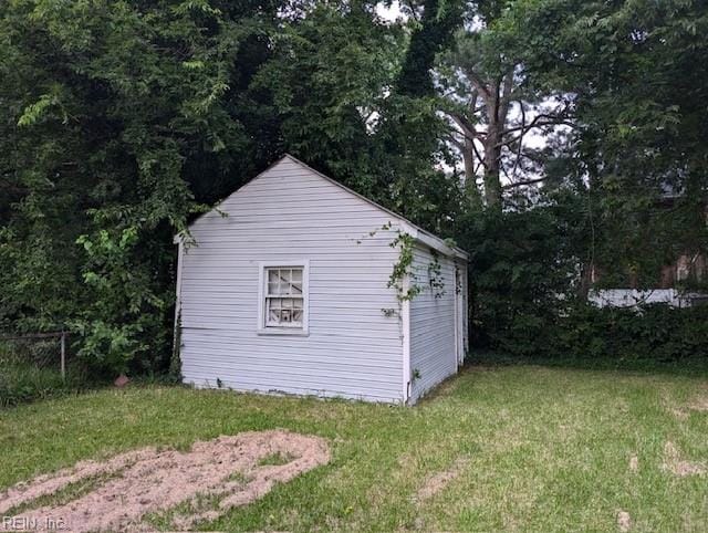 view of outdoor structure with a lawn