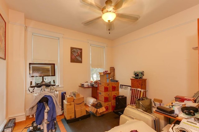 interior space with light wood-type flooring and ceiling fan