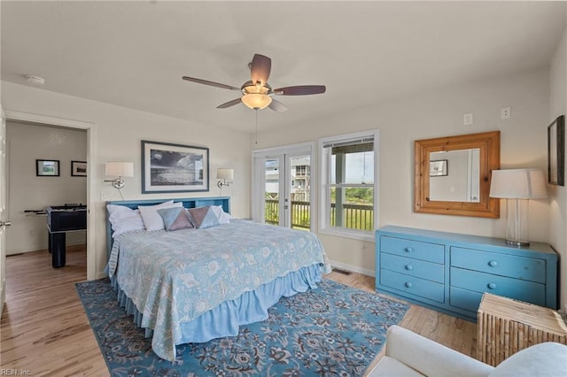 bedroom with access to outside, french doors, ceiling fan, light wood-type flooring, and baseboards