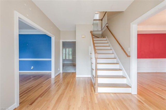 stairs featuring wood-type flooring