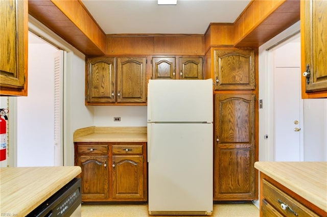 kitchen featuring dishwasher and white refrigerator