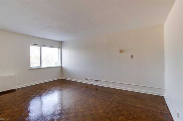 empty room with dark parquet floors