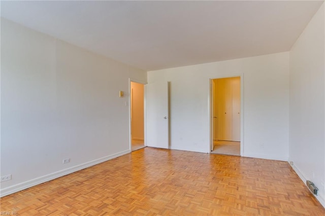 spare room with light parquet floors