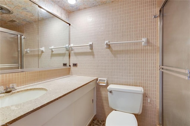 bathroom with backsplash, tile walls, toilet, and vanity