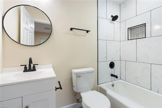 full bathroom featuring toilet, tiled shower / bath combo, and vanity