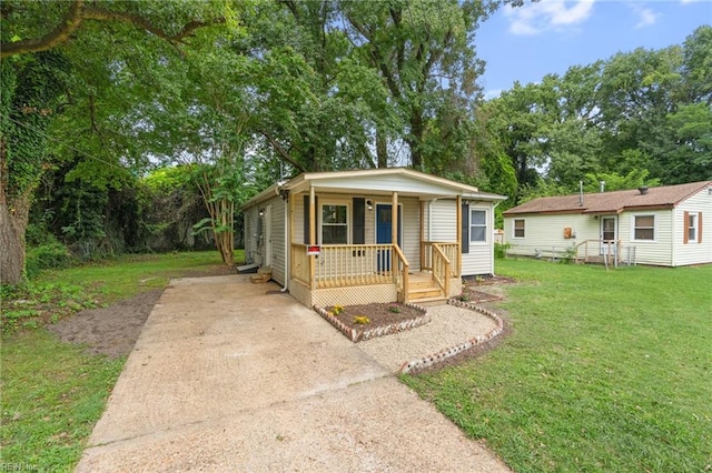 bungalow-style home with a porch and a front yard