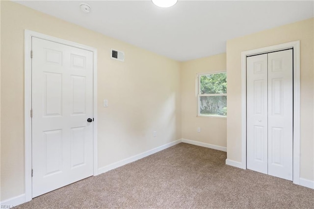 unfurnished bedroom featuring carpet flooring