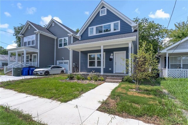 view of front of house featuring a garage and a porch