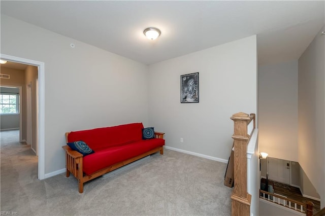 living area with light colored carpet