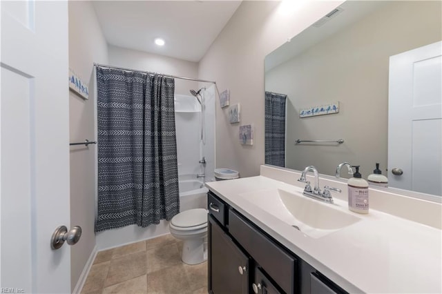 full bathroom with vanity, shower / tub combo, and toilet