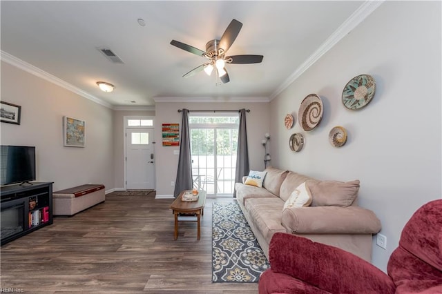 living room featuring ceiling fan, dark hardwood / wood-style floors, and crown molding