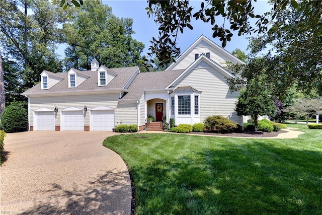 view of front facade featuring a garage and a front yard