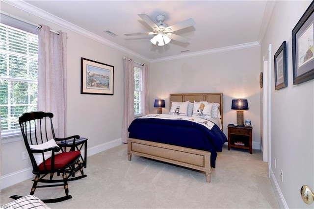 bedroom with ceiling fan, ornamental molding, and light colored carpet