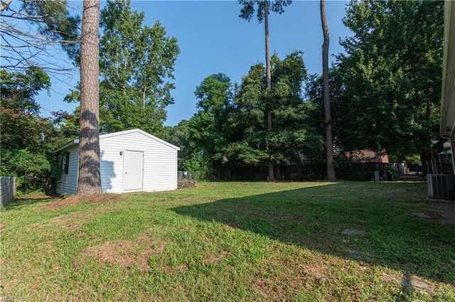 view of yard with a storage unit and central AC unit