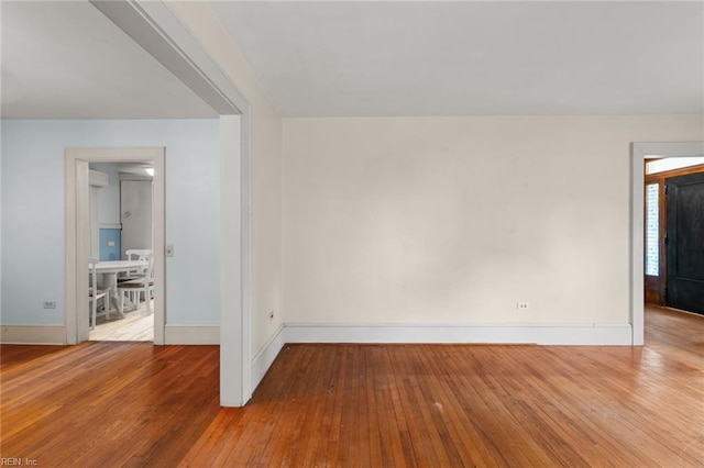 spare room featuring hardwood / wood-style flooring