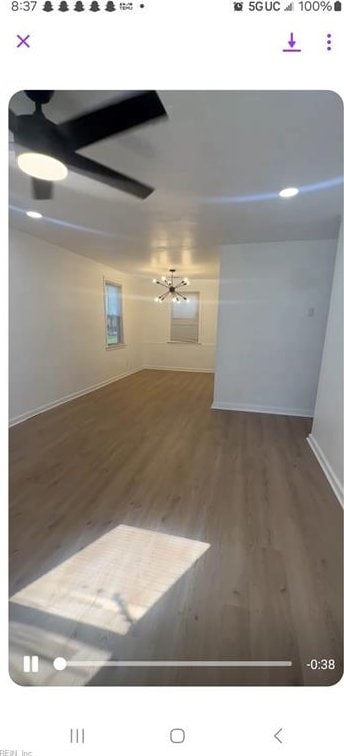 unfurnished room featuring ceiling fan and wood-type flooring