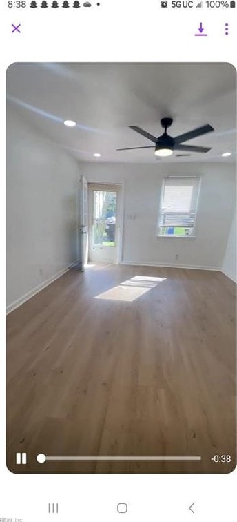 empty room featuring ceiling fan and wood-type flooring