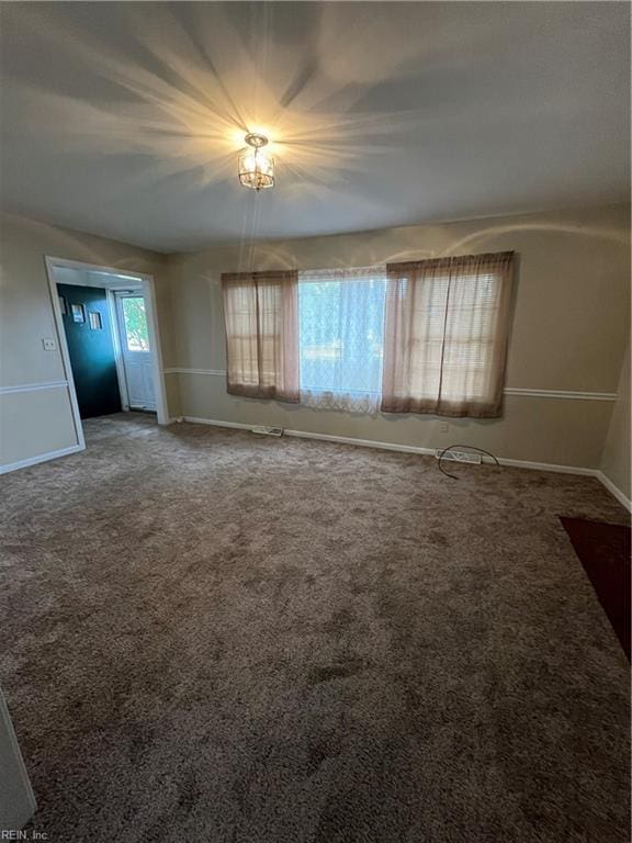 unfurnished living room with carpet flooring