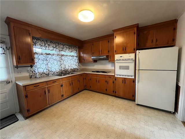 kitchen with sink and white appliances