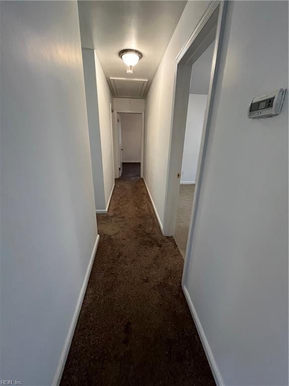 hall with dark carpet