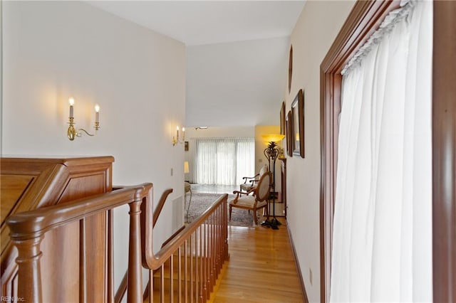 hallway with light hardwood / wood-style flooring