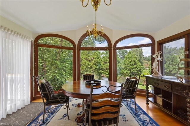 sunroom with a chandelier and a healthy amount of sunlight