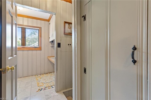 bathroom featuring tile patterned flooring and ornamental molding