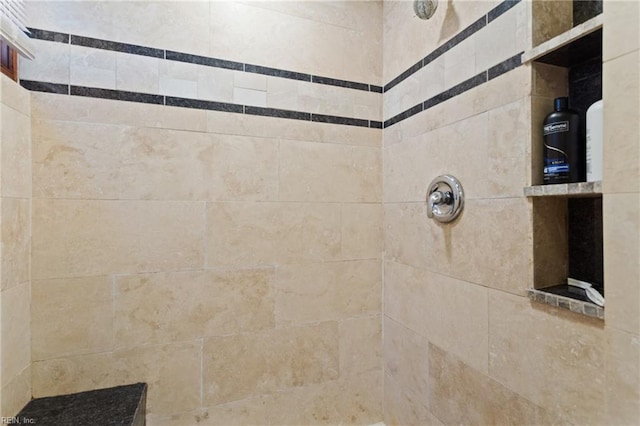 room details featuring a tile shower