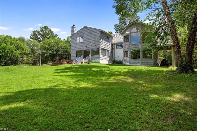 back of house with a yard