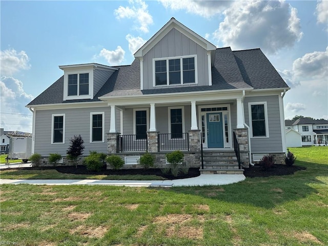 view of front of home with a front lawn and a porch