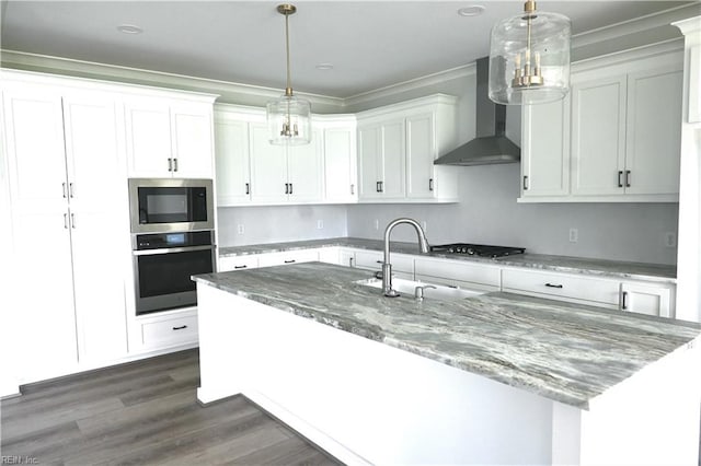 kitchen featuring wall chimney exhaust hood, decorative light fixtures, dark wood-type flooring, and stainless steel appliances