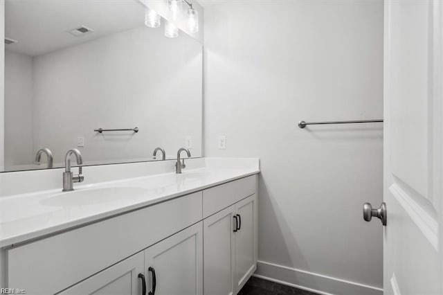 bathroom with dual bowl vanity
