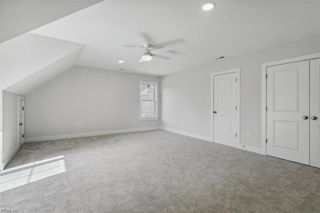 bonus room with carpet floors, vaulted ceiling, and ceiling fan