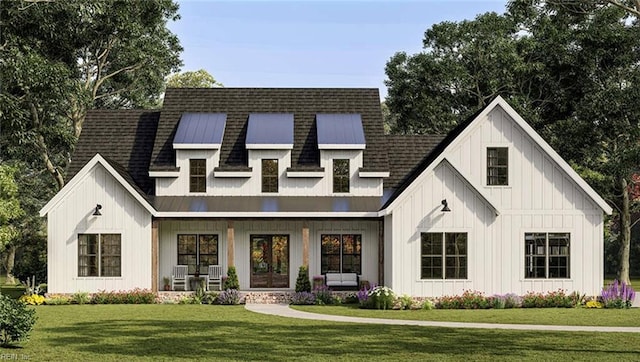 view of front facade featuring metal roof, a front lawn, roof with shingles, and board and batten siding