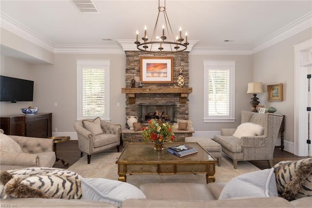 living area with ornamental molding, a stone fireplace, a wealth of natural light, and visible vents