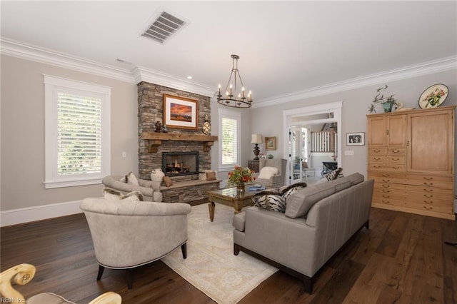 living area featuring dark wood-style flooring, visible vents, crown molding, and a fireplace