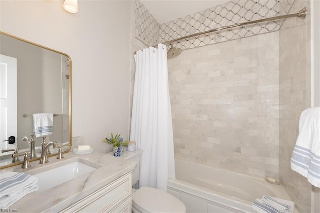 full bath featuring toilet, shower / bath combo with shower curtain, and vanity