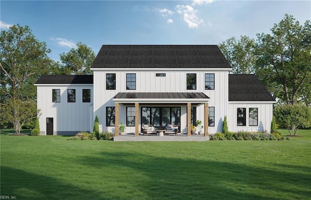 back of property featuring a patio, metal roof, a standing seam roof, a yard, and board and batten siding