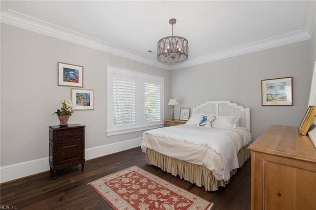 bedroom featuring baseboards, dark wood-type flooring, a notable chandelier, and crown molding