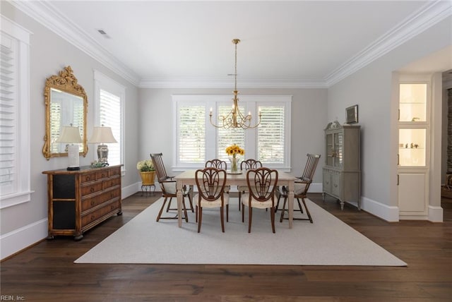 dining space with a chandelier, dark wood-type flooring, ornamental molding, and visible vents