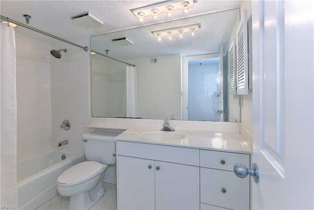 full bathroom featuring vanity, tile patterned floors, a textured ceiling, shower / bath combination with curtain, and toilet