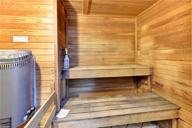 view of sauna / steam room featuring wooden walls