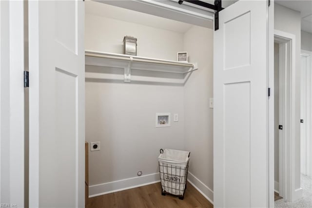 clothes washing area featuring electric dryer hookup, gas dryer hookup, hookup for a washing machine, and wood-type flooring