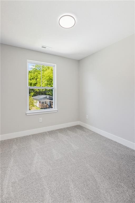 unfurnished room featuring carpet flooring